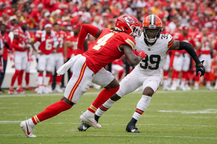 Aug 26, 2023; Kansas City, Missouri, USA; Kansas City Chiefs wide receiver Rashee Rice (4) runs the ball against Cleveland Browns cornerback Caleb Biggers (39) during the second half at GEHA Field at Arrowhead Stadium. Mandatory Credit: Denny Medley-USA TODAY Sports